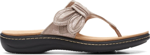 A beige thong sandal with a decorative knot on the upper.
