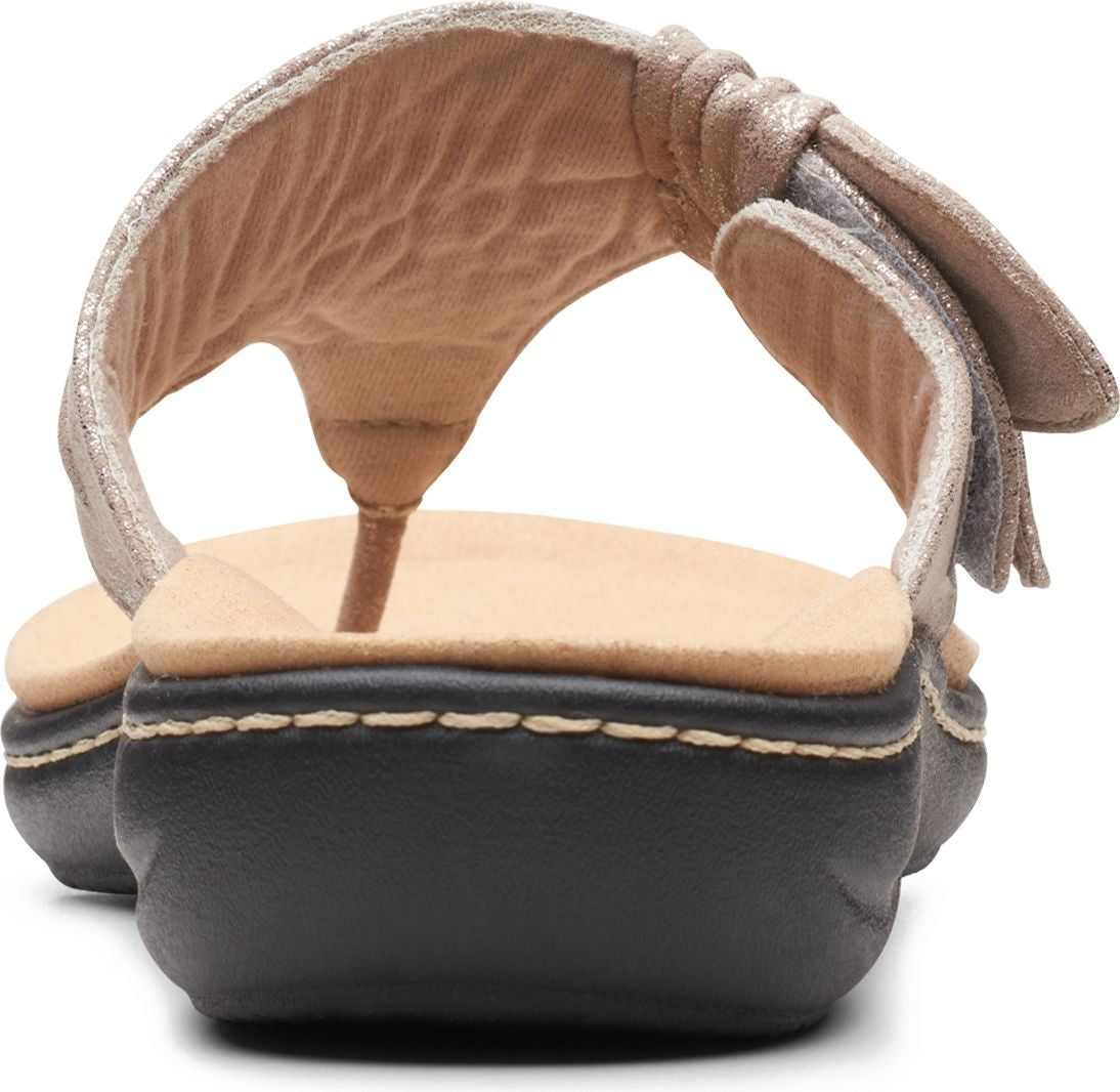 Close up rear view of a silver thong sandal with knotted strap and contrasting black sole.