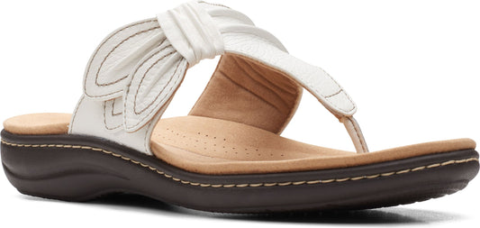 A white sandal with a brown sole.