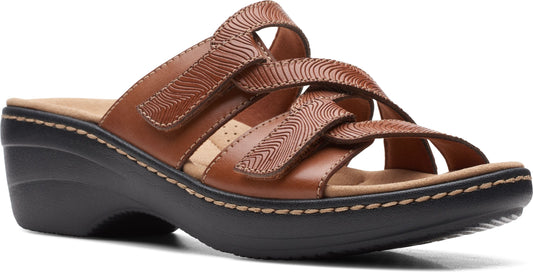Brown sandal with textured straps and black platform.