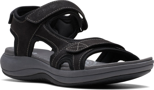 Black sandal with hook-and-loop adjustable straps and thick grey soles.