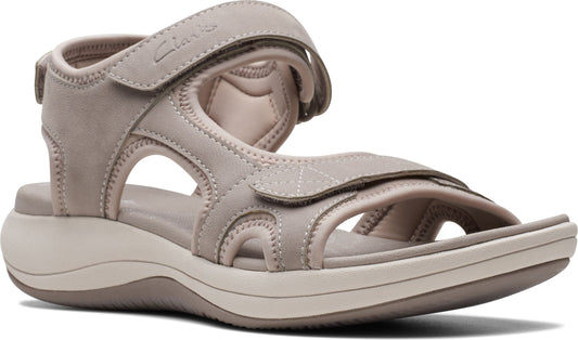 Beige sandal with velcro straps and cushioned sole.