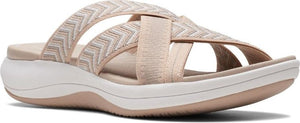 Beige slide sandal with zigzag pattern straps.