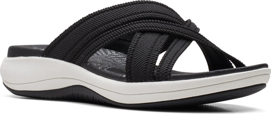 A black sandal with multiple cross straps and a white contoured sole.