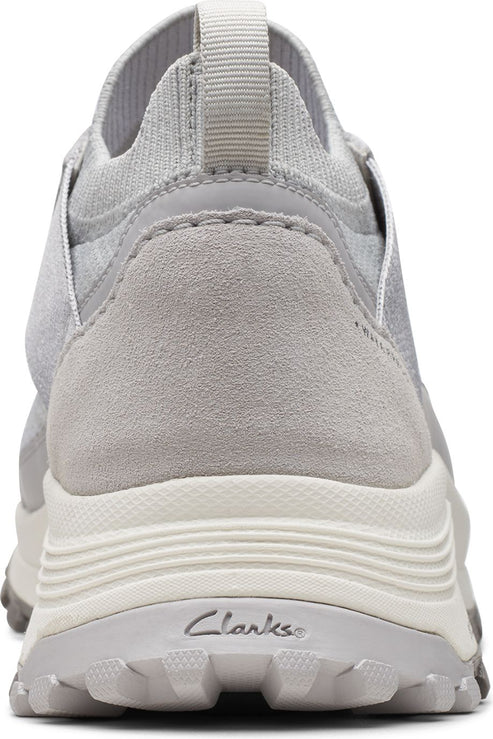 Rear view of a gray sneaker with a thick, ridged sole and a fabric upper.