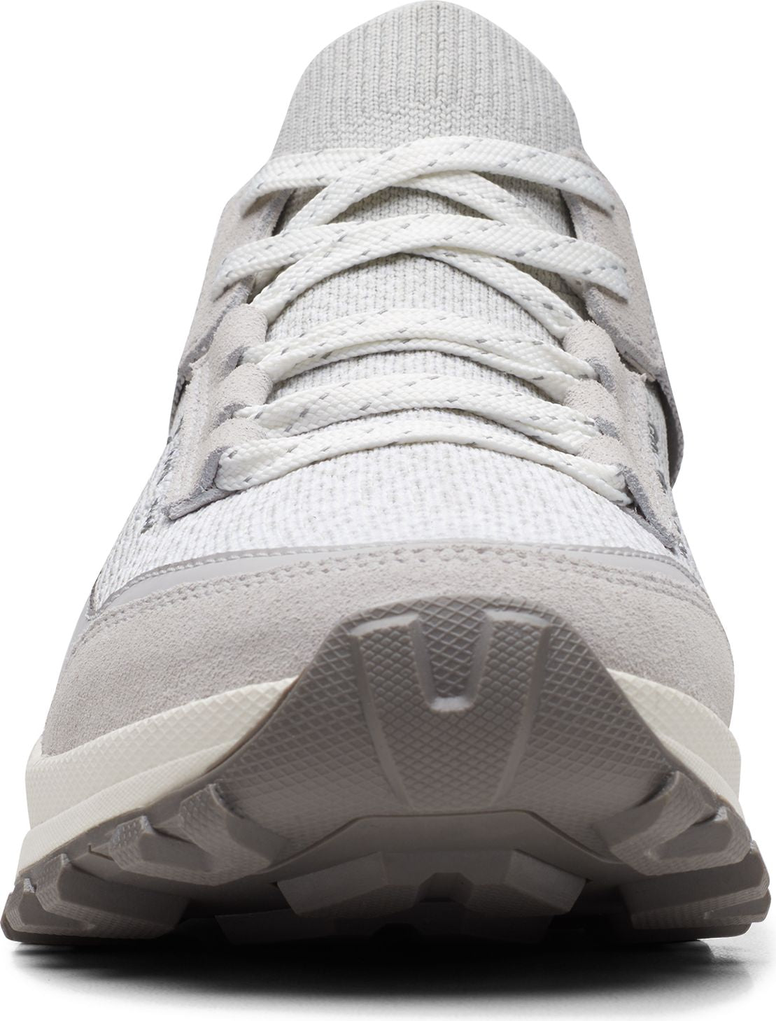 A gray sneaker with gray laces and a gray sole.