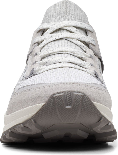 A gray sneaker with gray laces and a gray sole.