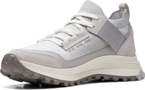A gray hiking shoe with laces, a ridged outsole, and mixed suede and mesh upper.