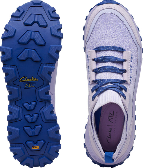 The bottom view shows the lug pattern in blue color. The top view shows the laces in blue color and the label says Clarks ATL.