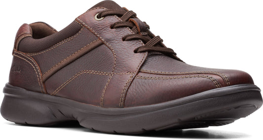 Brown leather walking shoe with textile trim and dark sole.