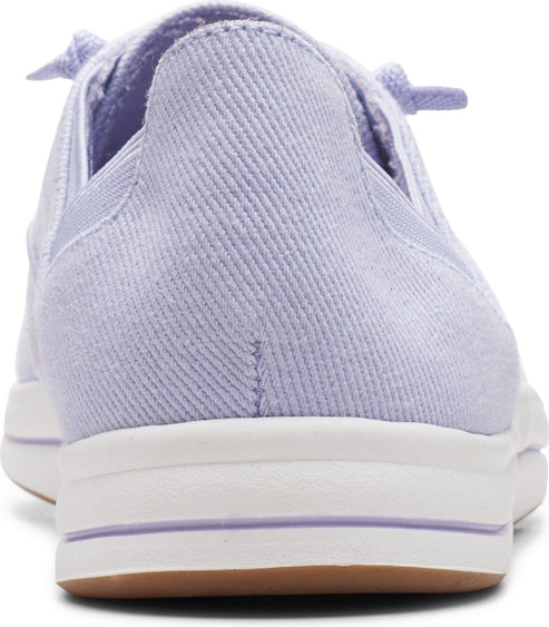 Close-up of a lavender sneaker with white platform sole and tan outsole.