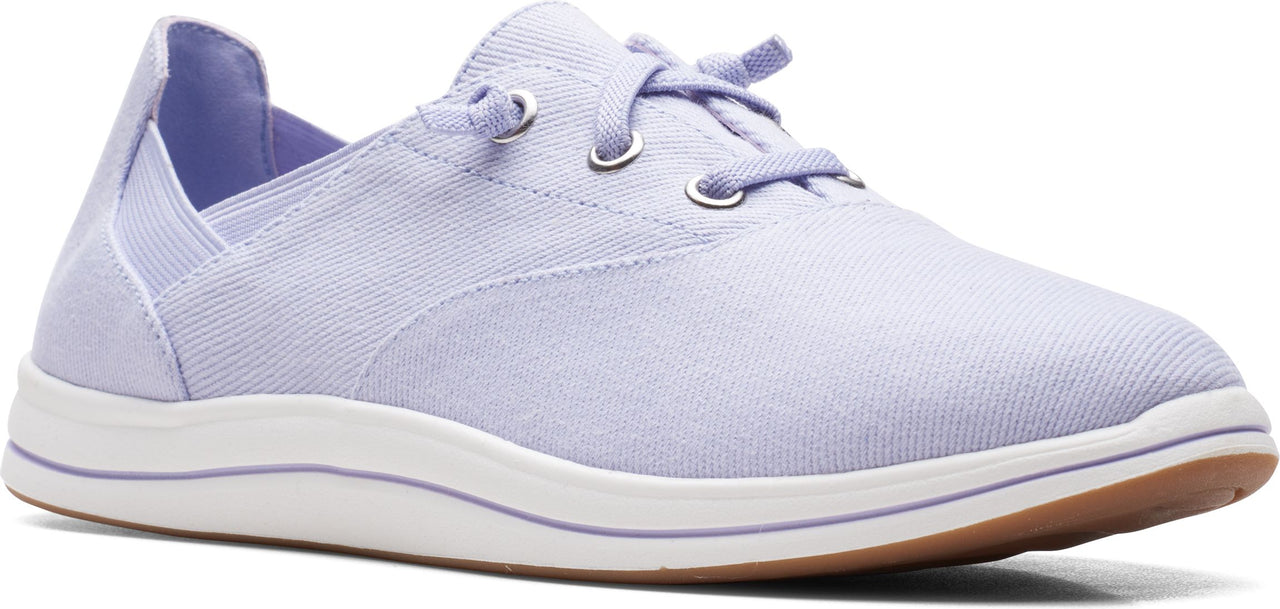 A light purple canvas shoe with white soles and a brown bottom.