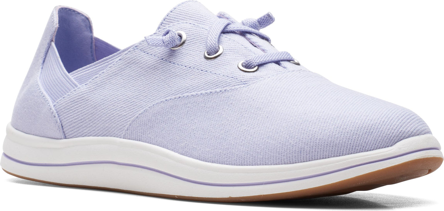 A light purple canvas shoe with white soles and a brown bottom.