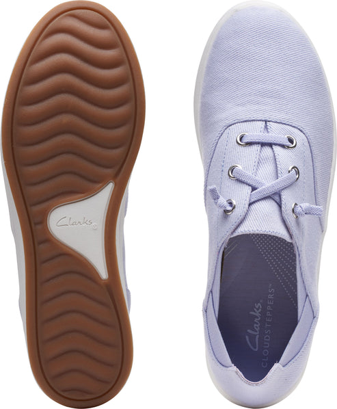 Light-purple canvas sneakers with brown soles and white midsoles.