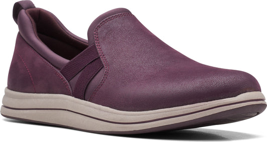 Aubergine slip-on shoe with elastic band and a tan sole.