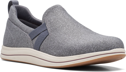 A gray slip-on sneaker with a neutral sole.