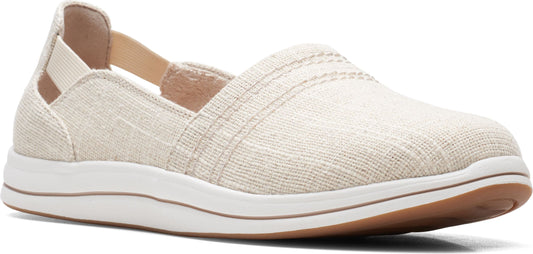 A slip-on shoe in a natural fabric with a white sole.