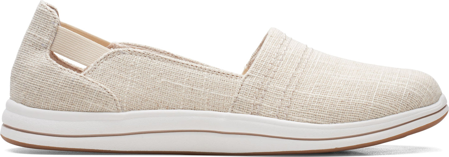 A beige slip-on shoe with a white sole.