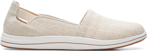 A beige slip-on shoe with a white sole.