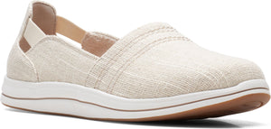 A slip-on shoe with a beige woven upper and white sole.