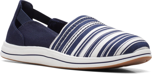 A slip-on shoe with navy and white stripes on top, with a white rubber sole and brown outsole.
