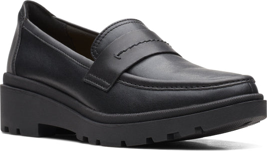 Black leather loafer with chunky sole and low wedge heel.