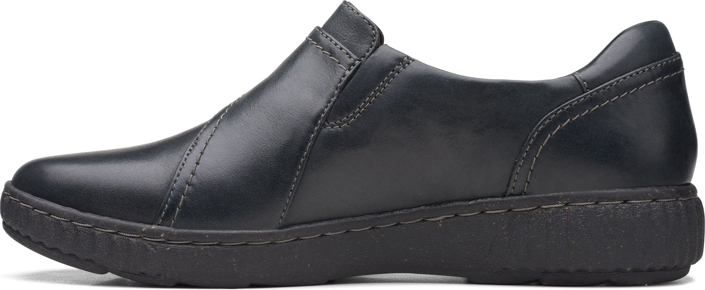 A slip-on shoe with a black leather upper and a low black sole.