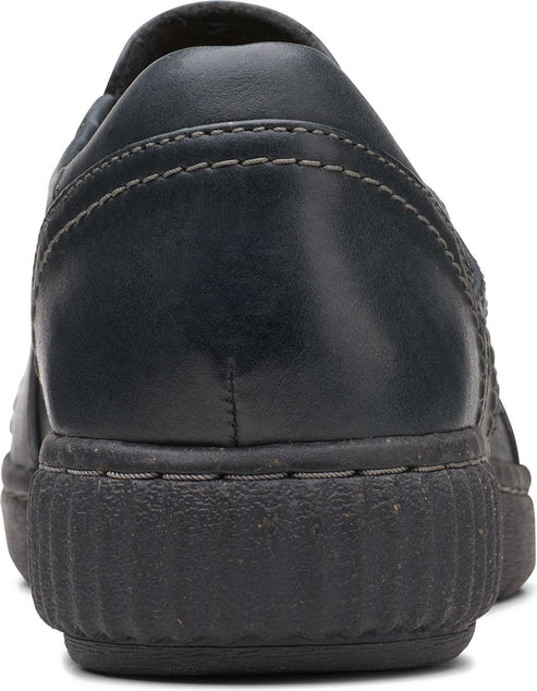 Back of a black leather slip-on shoe with a rubber sole.