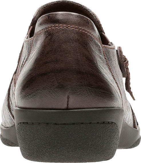 Dark brown leather shoe from the back with a low, dark sole.