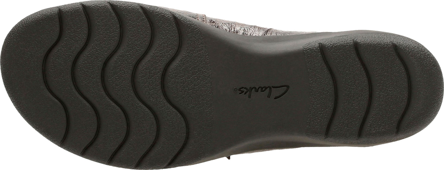 The sole of a shoe with a wavy tread pattern and a logo that says "Clarks".