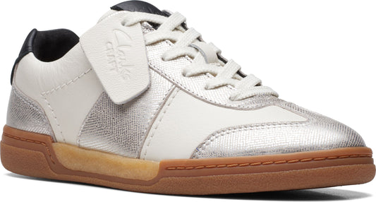 Low-top sneaker in white leather with silver accents and a brown rubber sole; tag reads "Clarks".