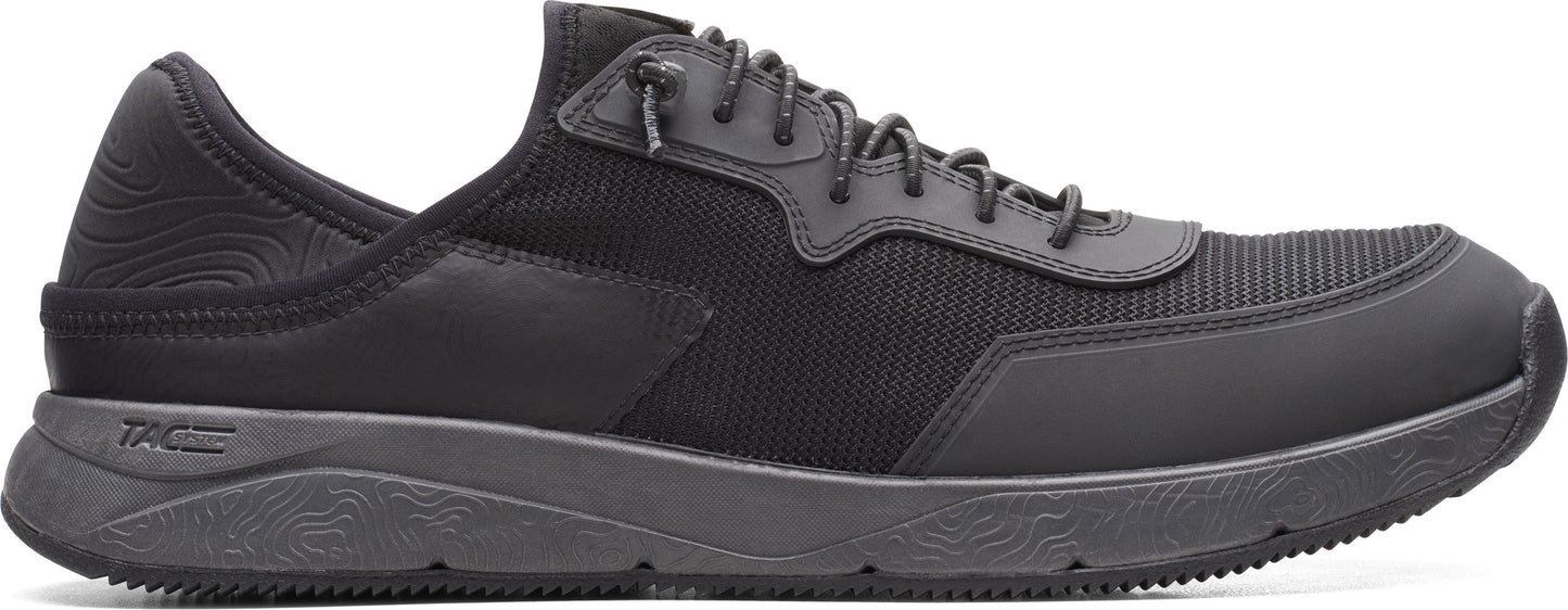 A black sneaker with black laces.