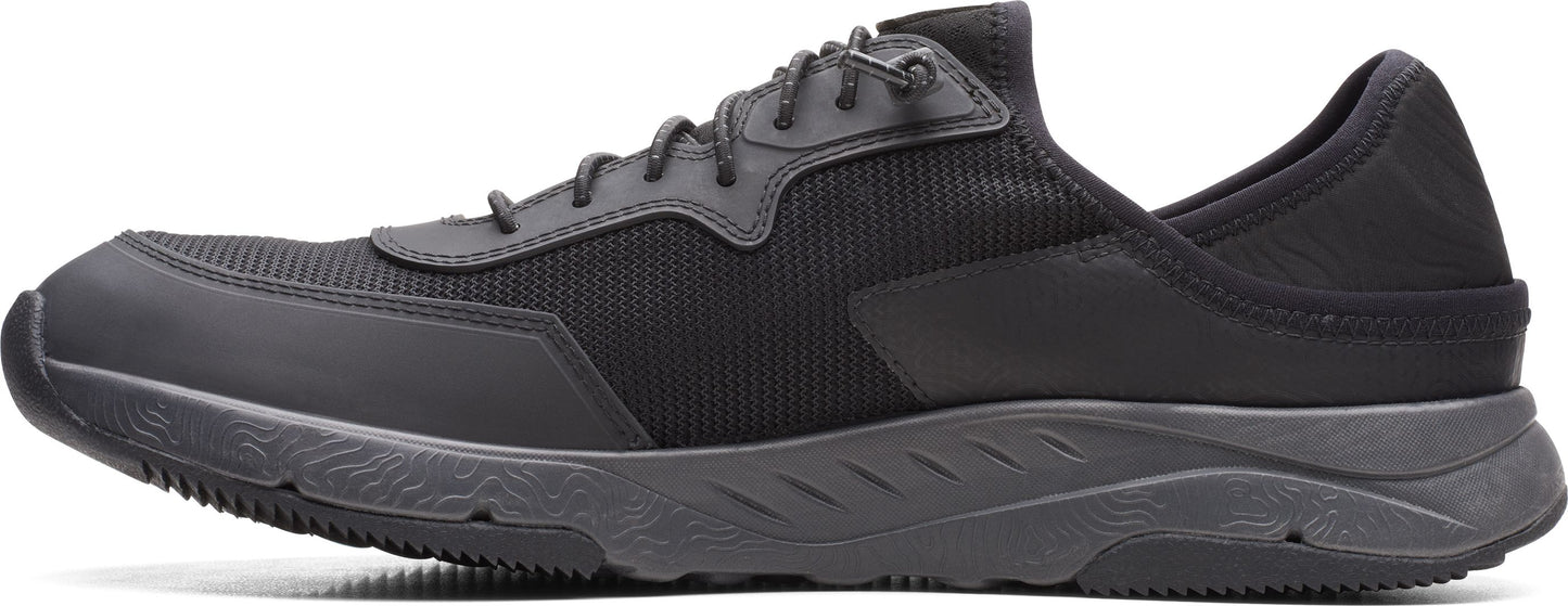 A black athletic shoe with black laces.