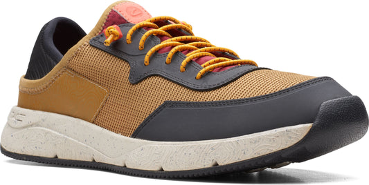 Tan and black athletic shoe with orange laces.
