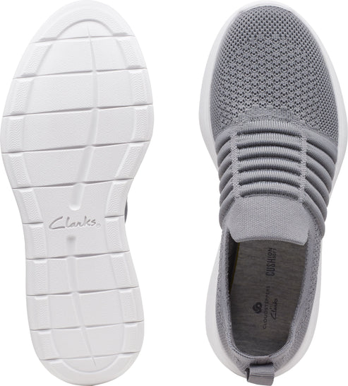 Top-down view of grey slip-on knit sneaker with white sole, showing the sole and insole.