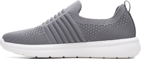A grey knit shoe with a white sole.