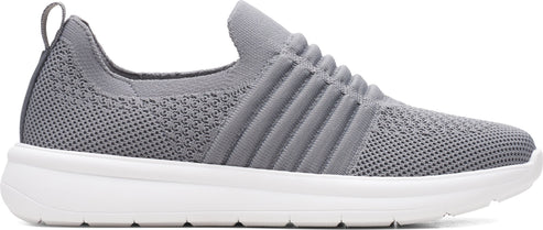 A grey, slip-on sneaker with a white sole and ribbed detailing across the upper.