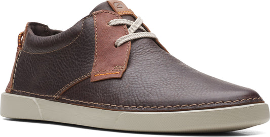 Low-cut brown leather shoe with off-white laces and sole, accented by a caramel-colored lace overlay.