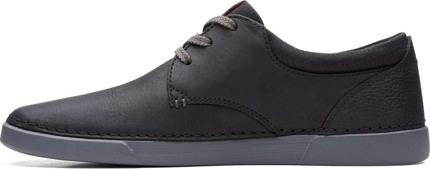 a black shoe with gray laces and sole