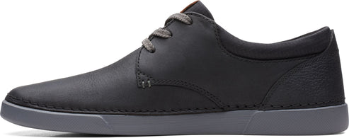 a black shoe with gray laces and sole