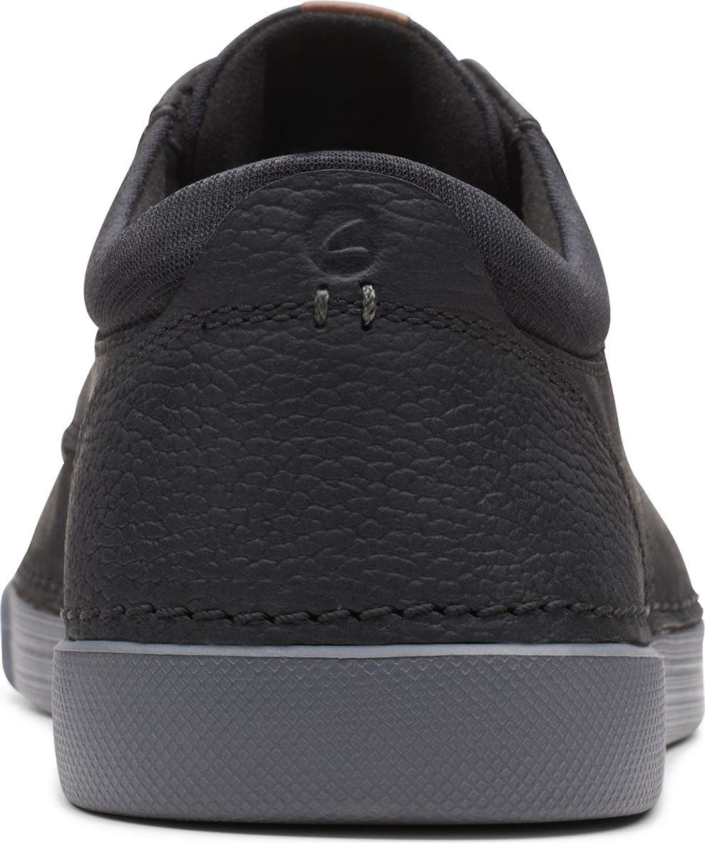 Back view of black casual leather shoe with gray sole.