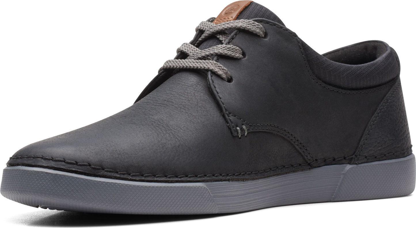Black leather sneaker with gray laces and gray sole.
