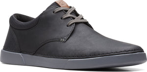 A gray low top shoe with gray laces.