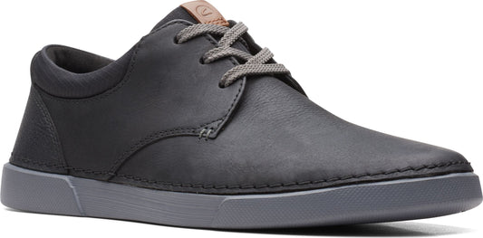 A gray low top shoe with gray laces.
