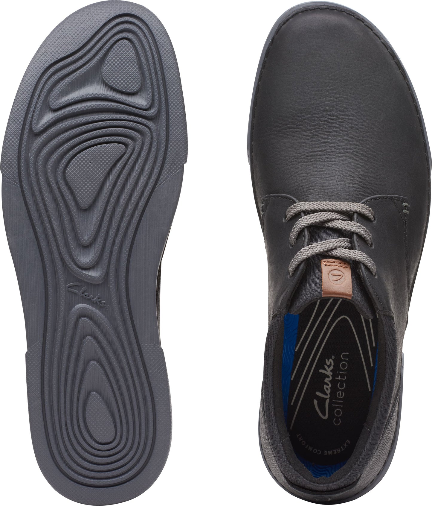 Two dark gray shoes: the left shows the grooved sole, while the right shows the top, with gray laces and a label inside that reads "Clarks collection".
