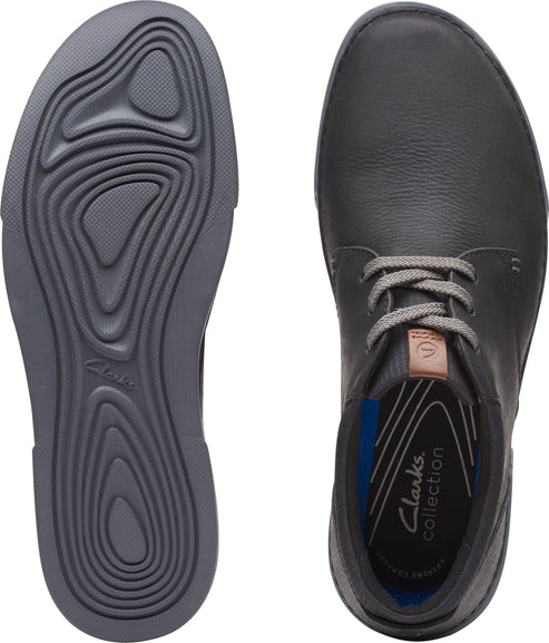 Two dark gray shoes: the left shows the grooved sole, while the right shows the top, with gray laces and a label inside that reads "Clarks collection".