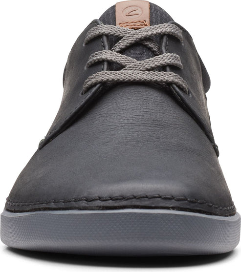 Close-up of gray leather shoe with gray laces.
