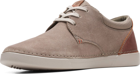 Low-rise gray suede sneaker with white laces and a brown leather accent on the heel.