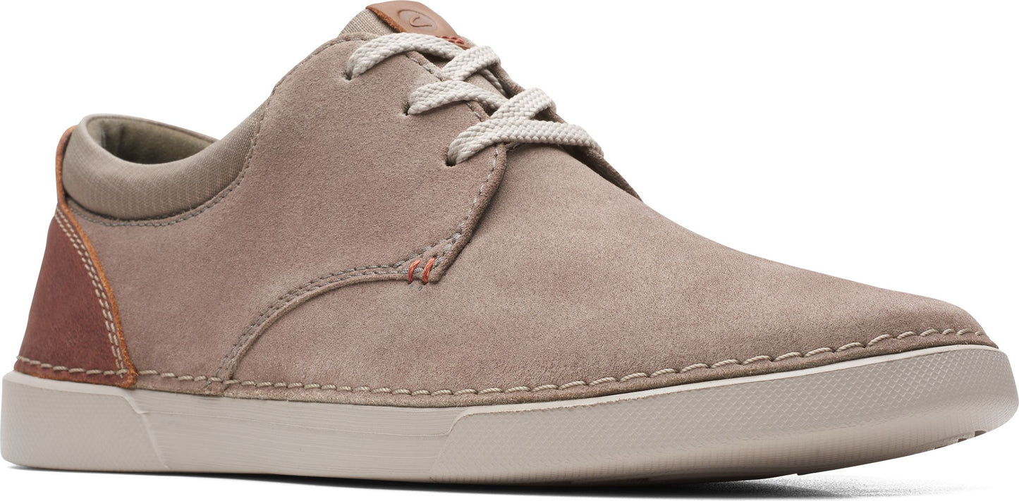 A taupe suede shoe with white laces and a light sole.