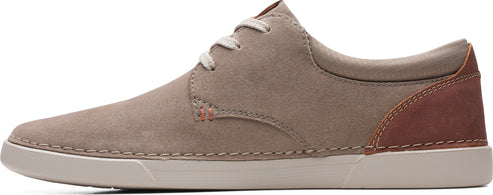 A brown casual dress shoe with white laces and a white sole.